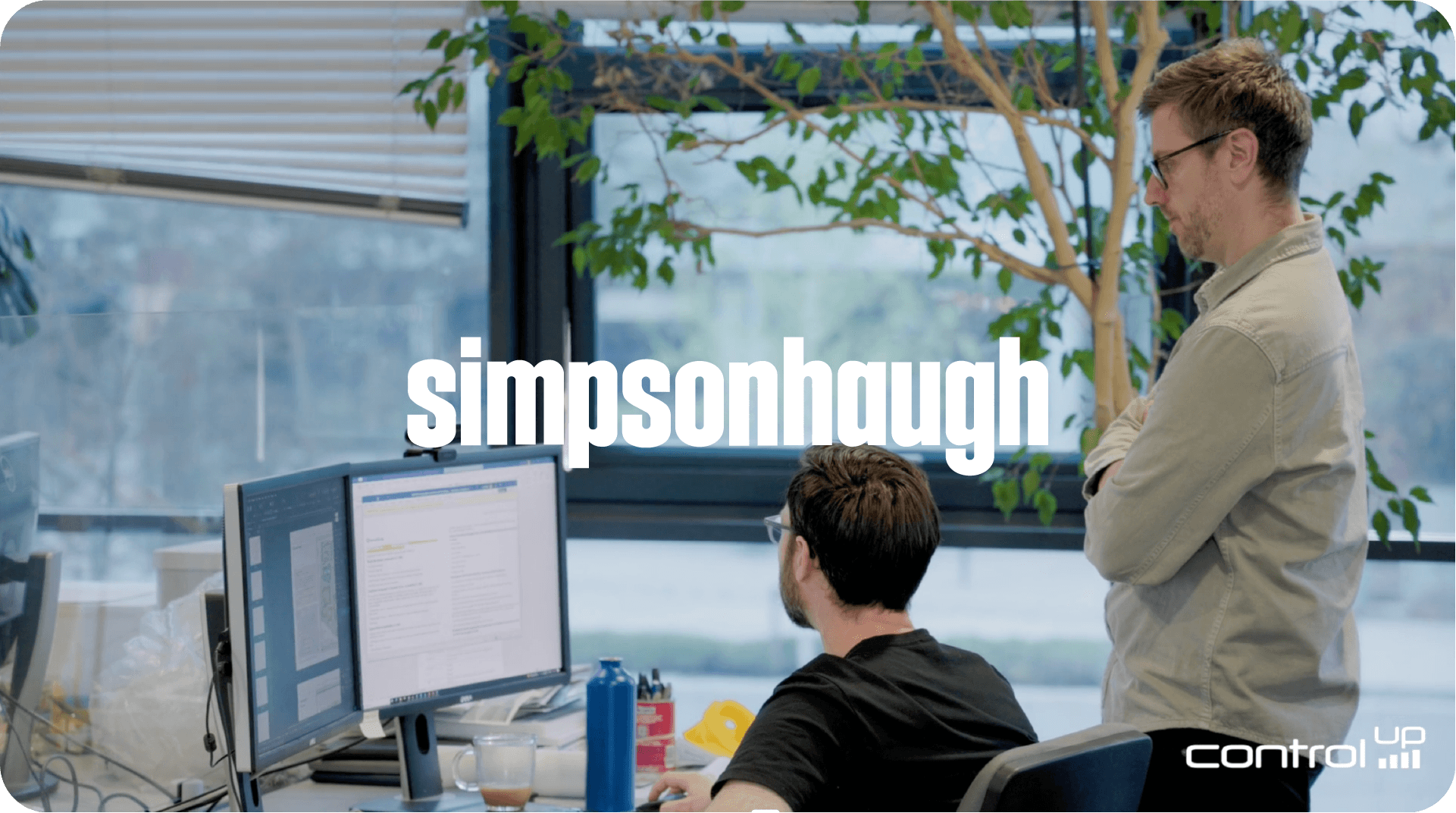 SimpsonHaugh architecture firm two people working on computer